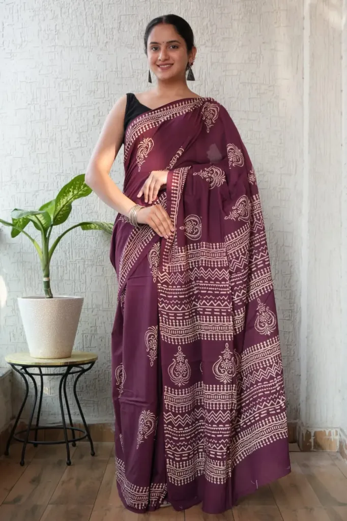 Hand block dabu printed magenta cotton mulmul saree