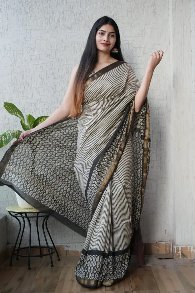 Hand block, kalamkari Ajrak Printed beige black colour schem with a striped pattern maheswari Silk Saree